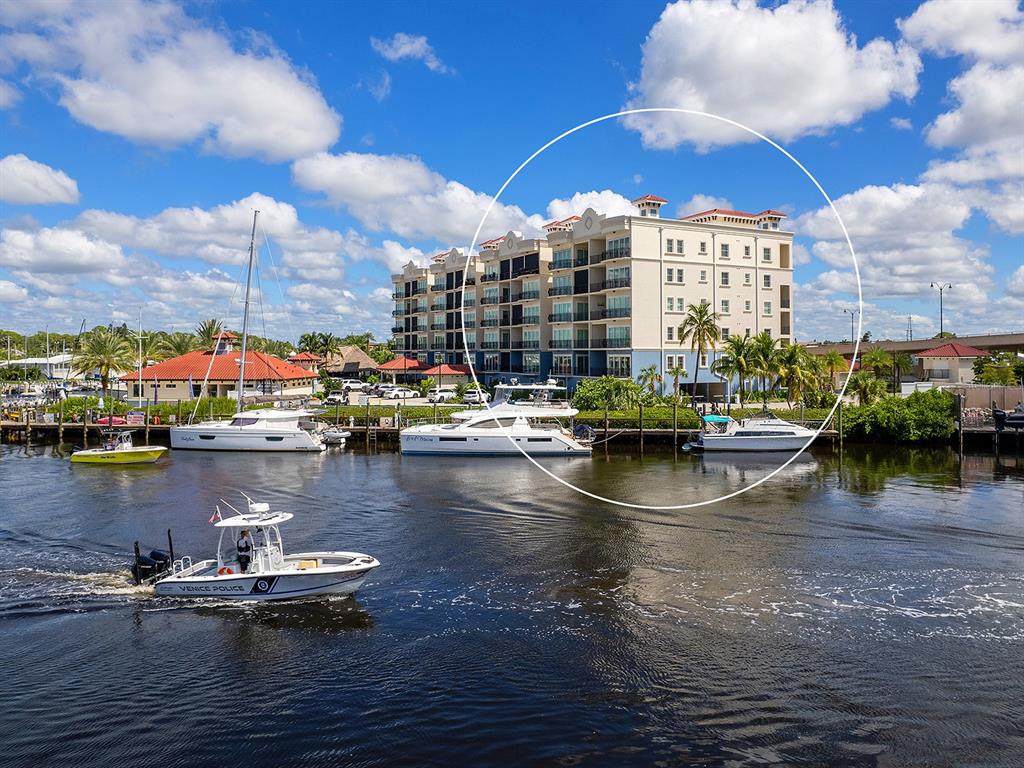 a view of water with boats and trees