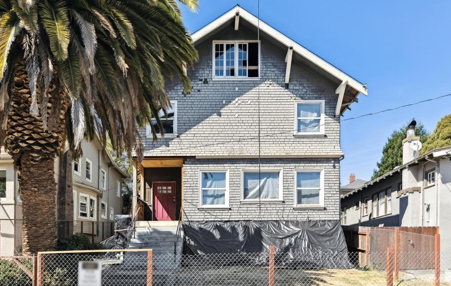 a front view of a house with parking space