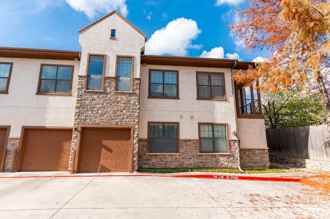 a front view of a house with garage