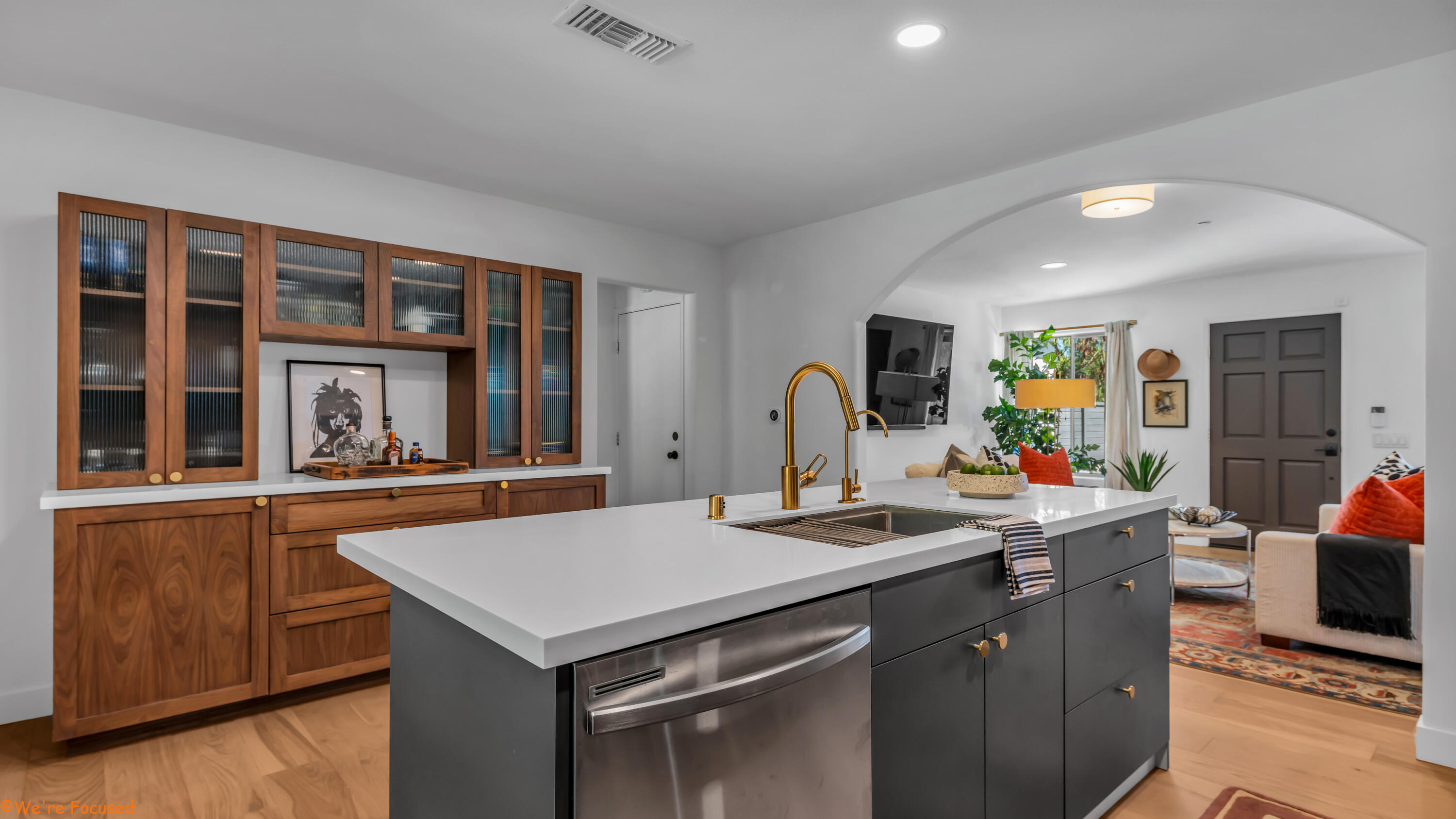 a kitchen with a stove a sink and a refrigerator