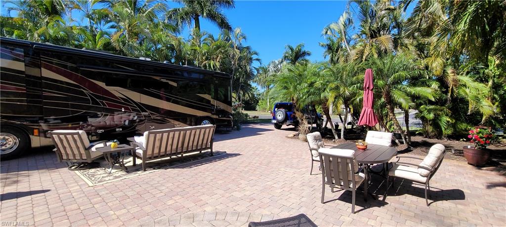 a view of backyard with furniture and a grill