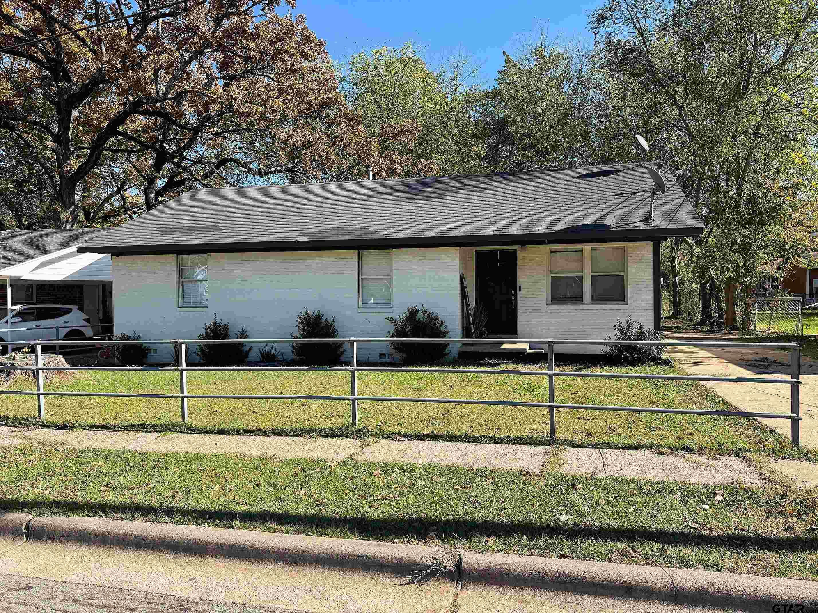 a view of a house with small backyard