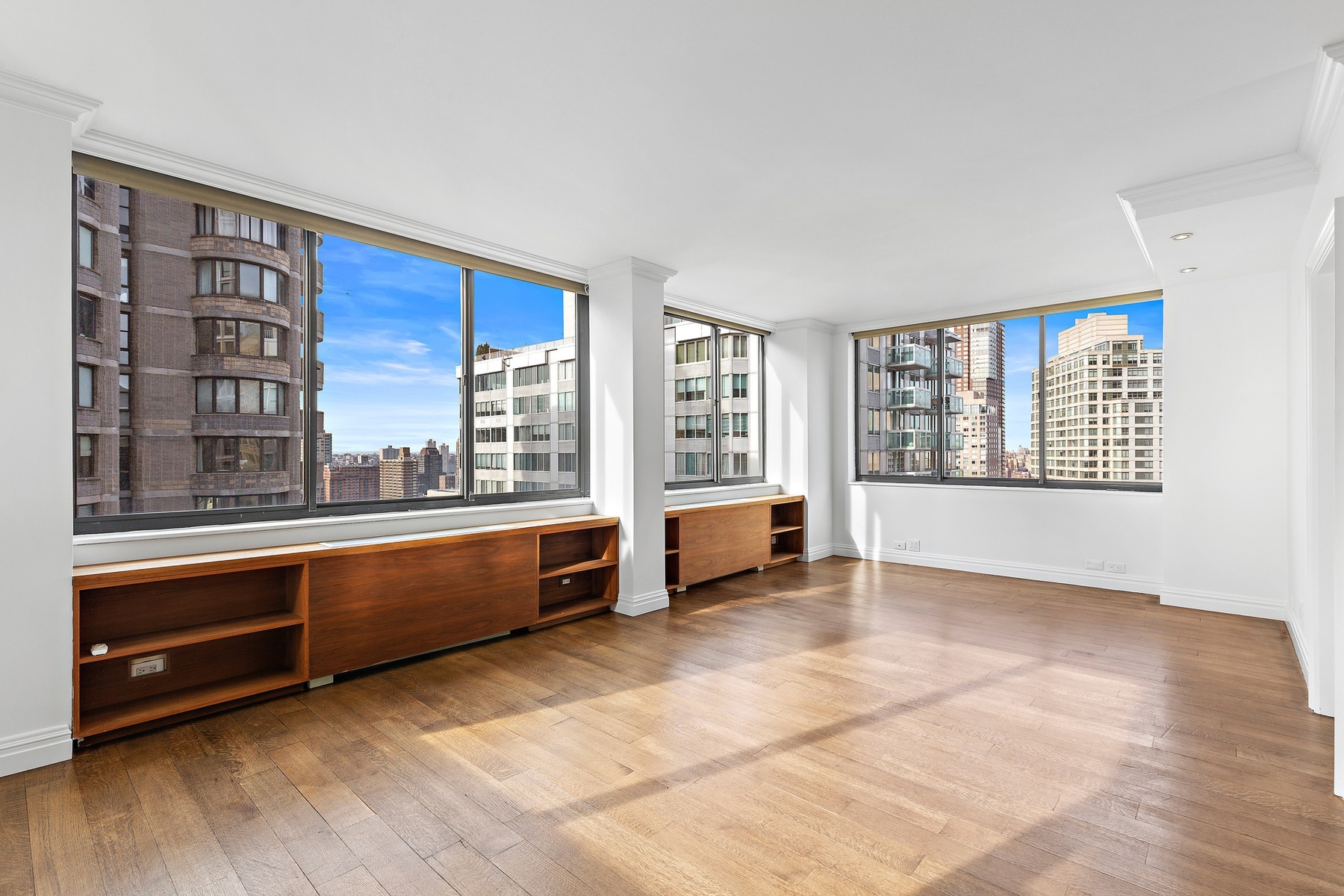 a large living room with windows