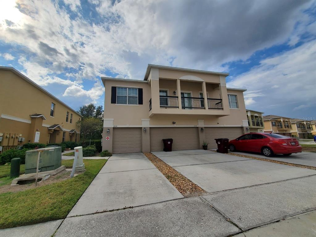 a front view of a house with a yard