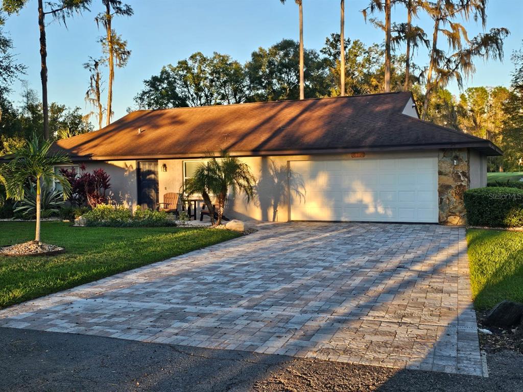 a view of a house with a yard