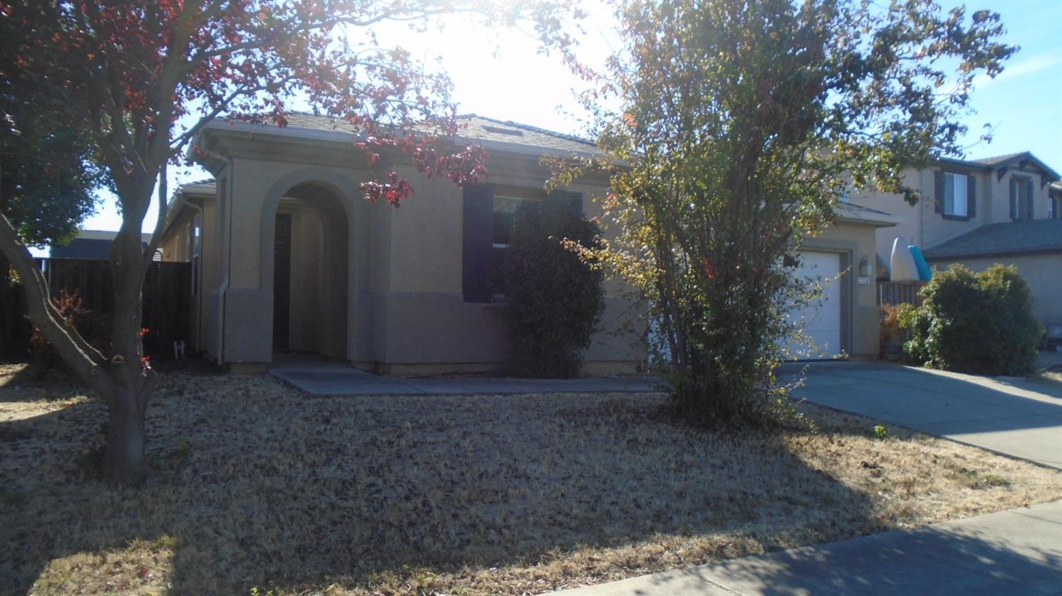 a view of a house with a tree