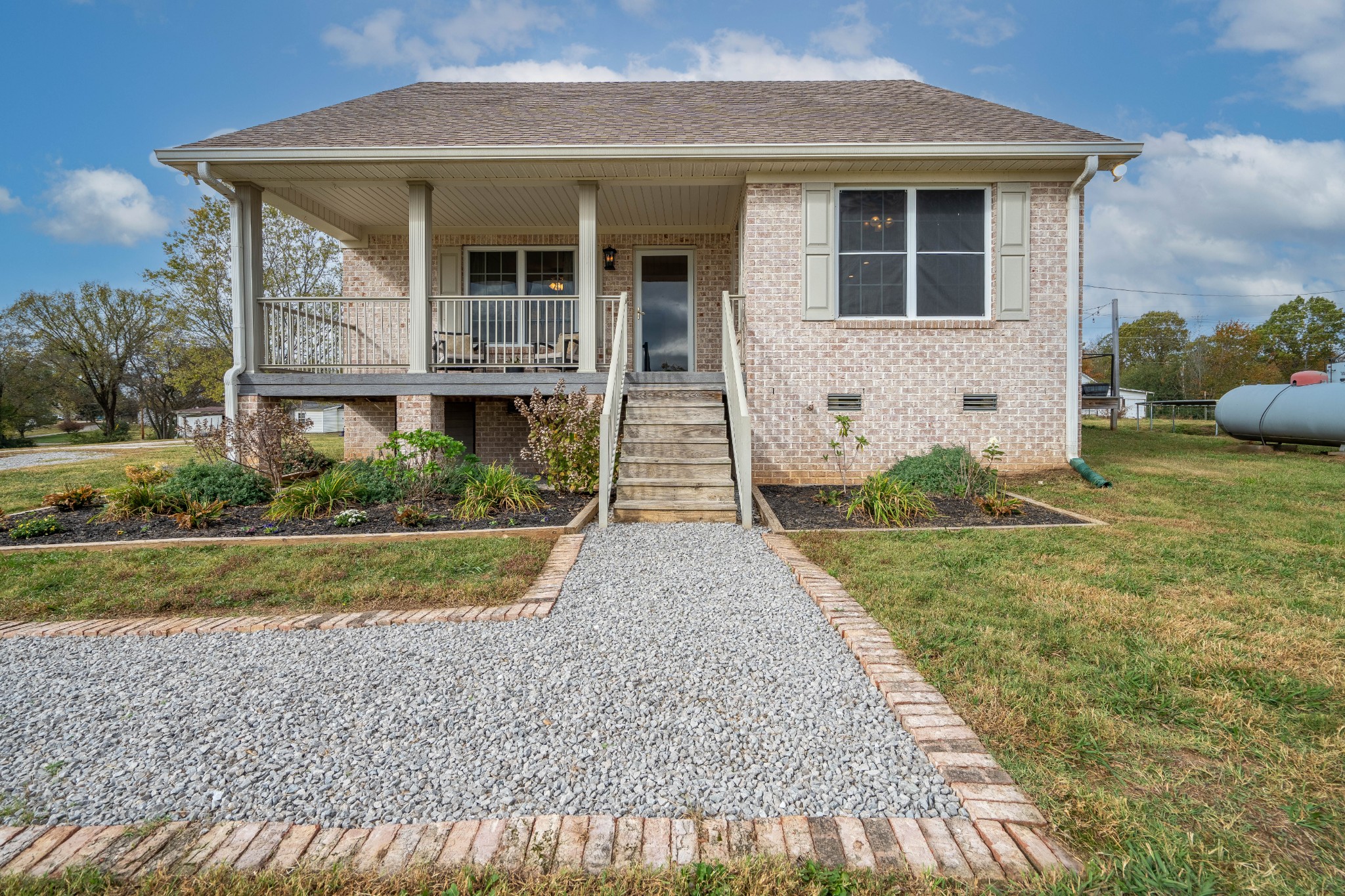 a front view of a house with garden