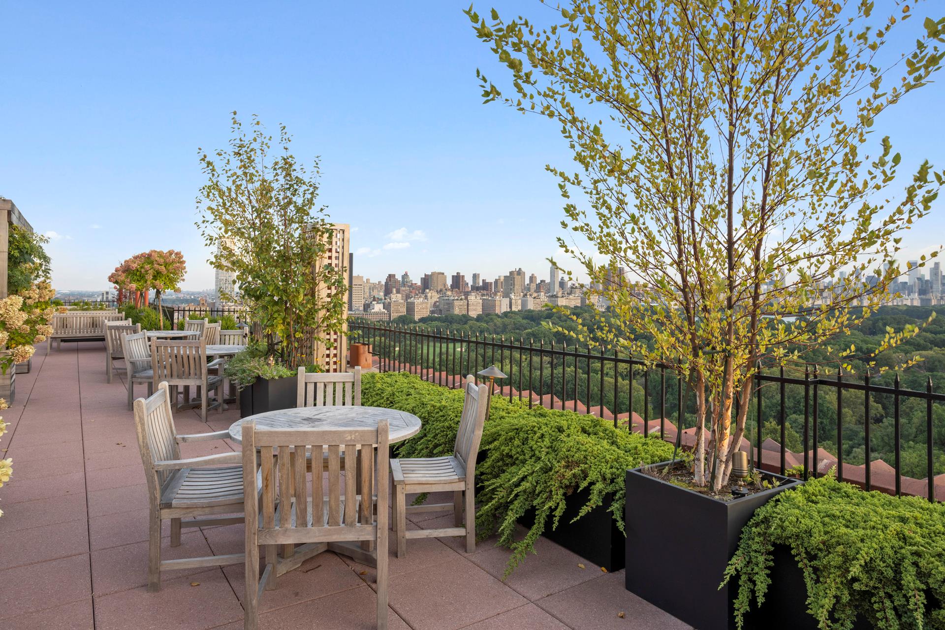 a view of a chairs and table in the garden