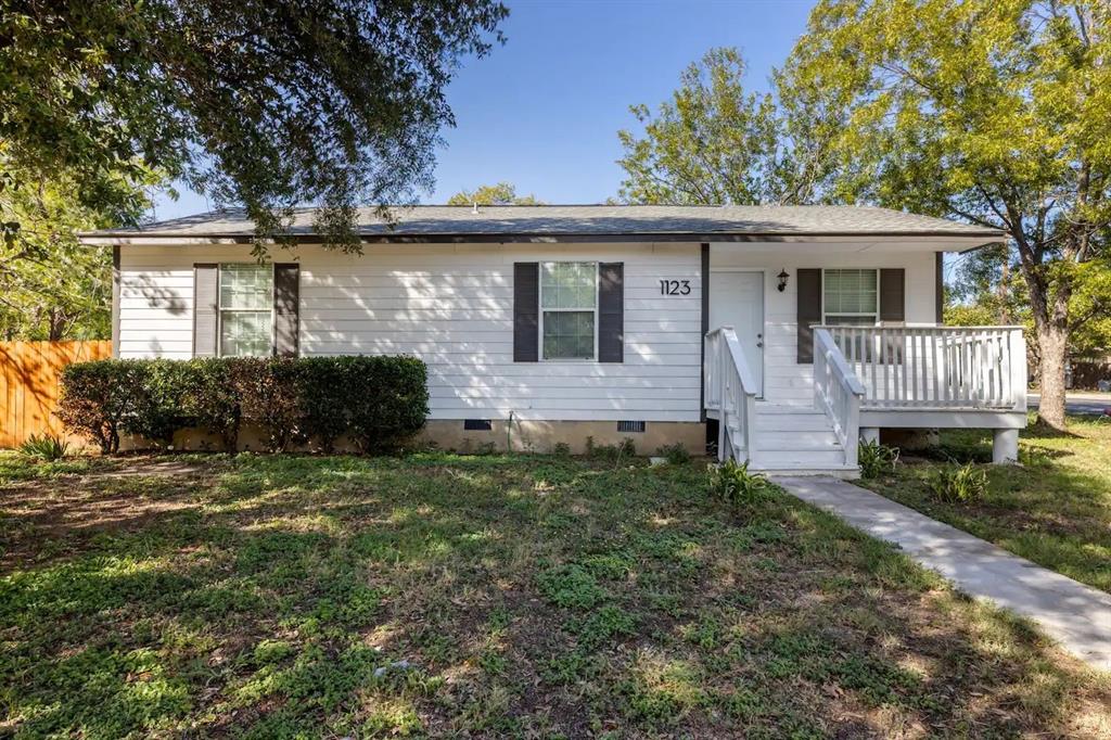 front view of a house with a yard