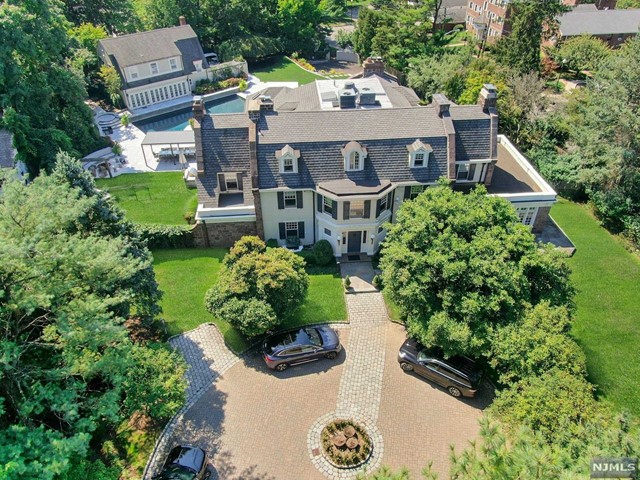 an aerial view of a house with a yard and plants