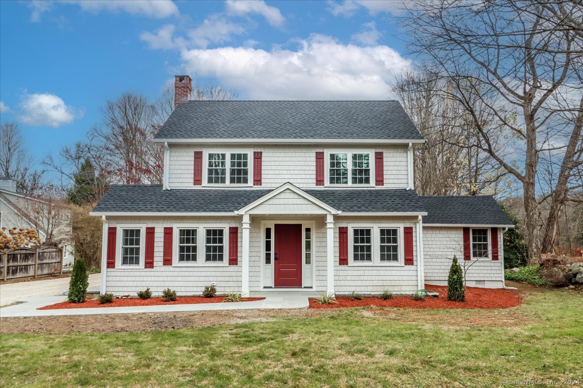 front view of a house with a yard