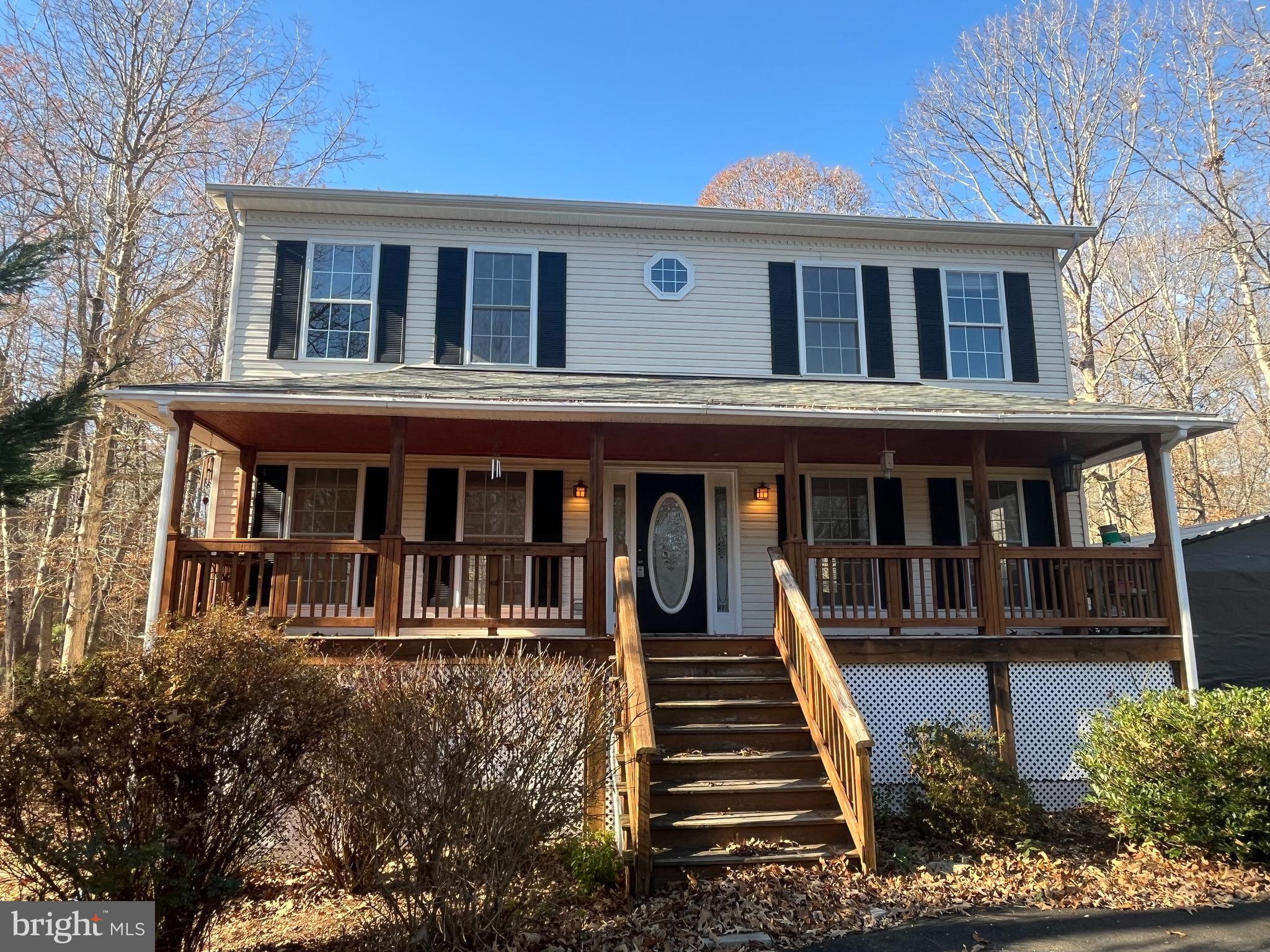 a front view of a house with stairs