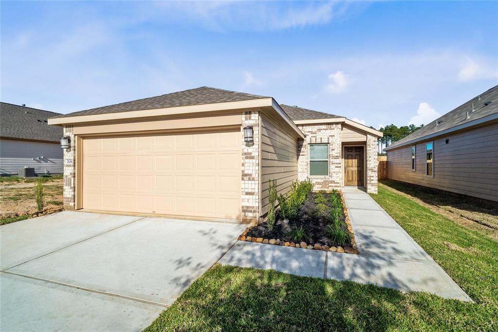 Welcome home to 2636 Bluewood Court located in Grace Landing and zoned to Willis ISD!