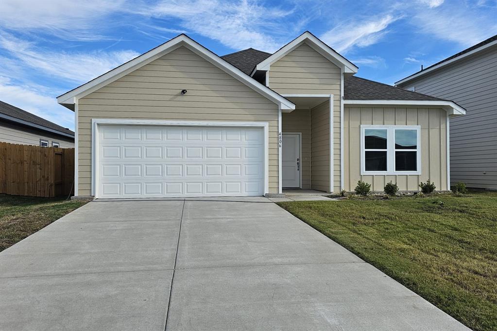 front view of a house and a garage