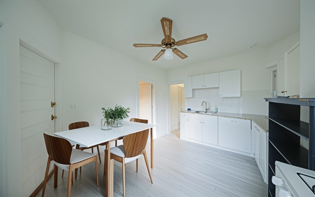 a kitchen with a table and chairs in it