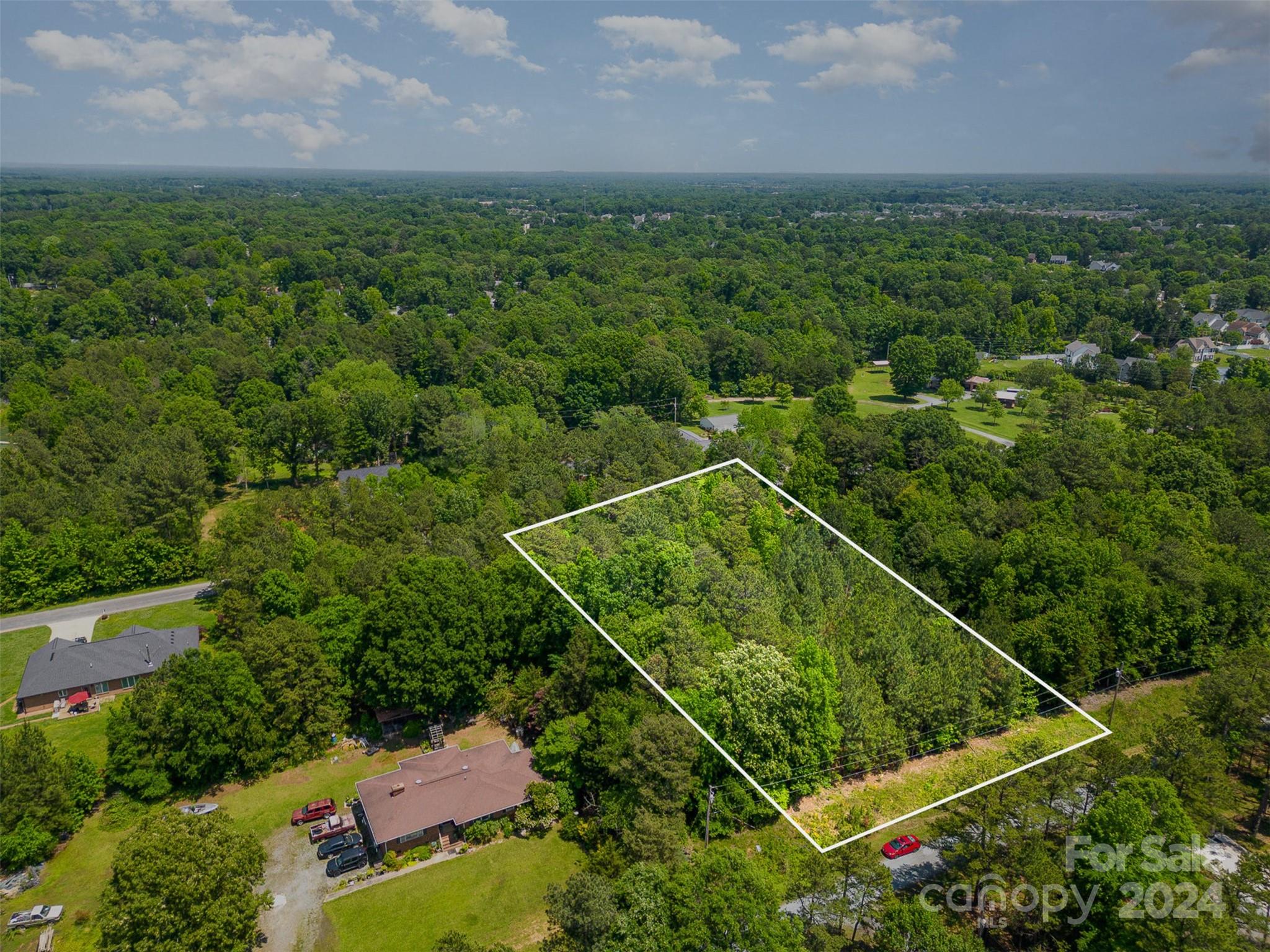 an aerial view of residential house with outdoor space