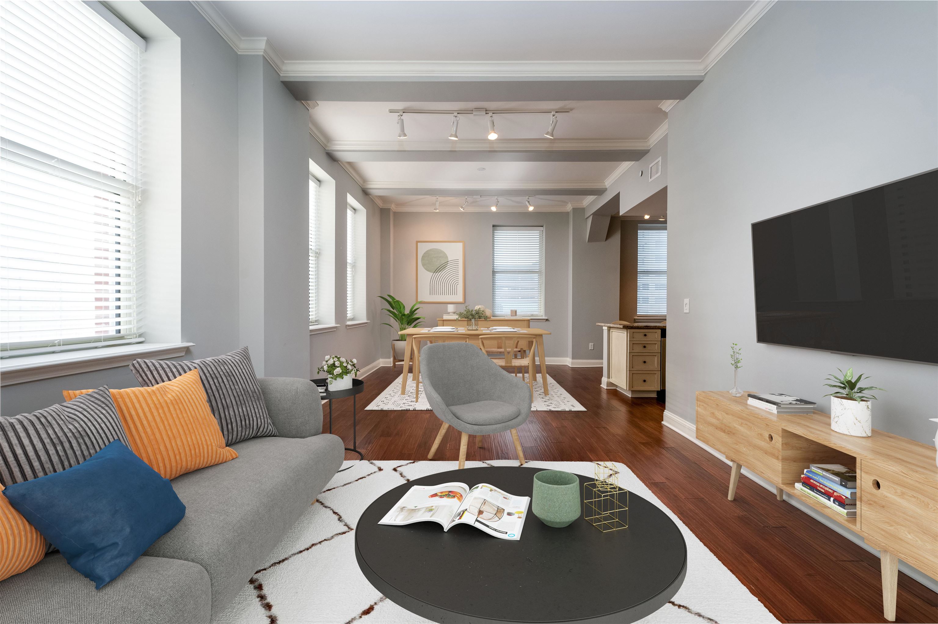 a living room with furniture and a flat screen tv