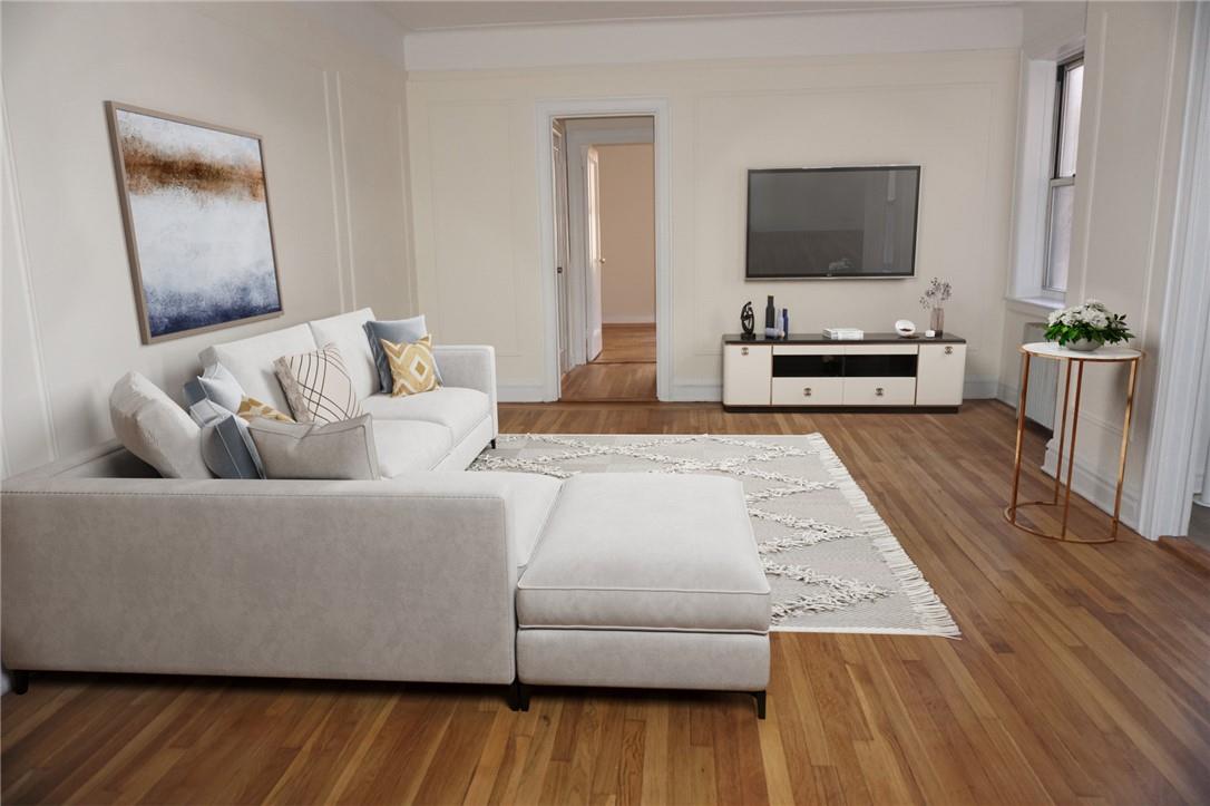 Welcome home to 19 William Street. Living room featuring hard wood floors (virtually staged)