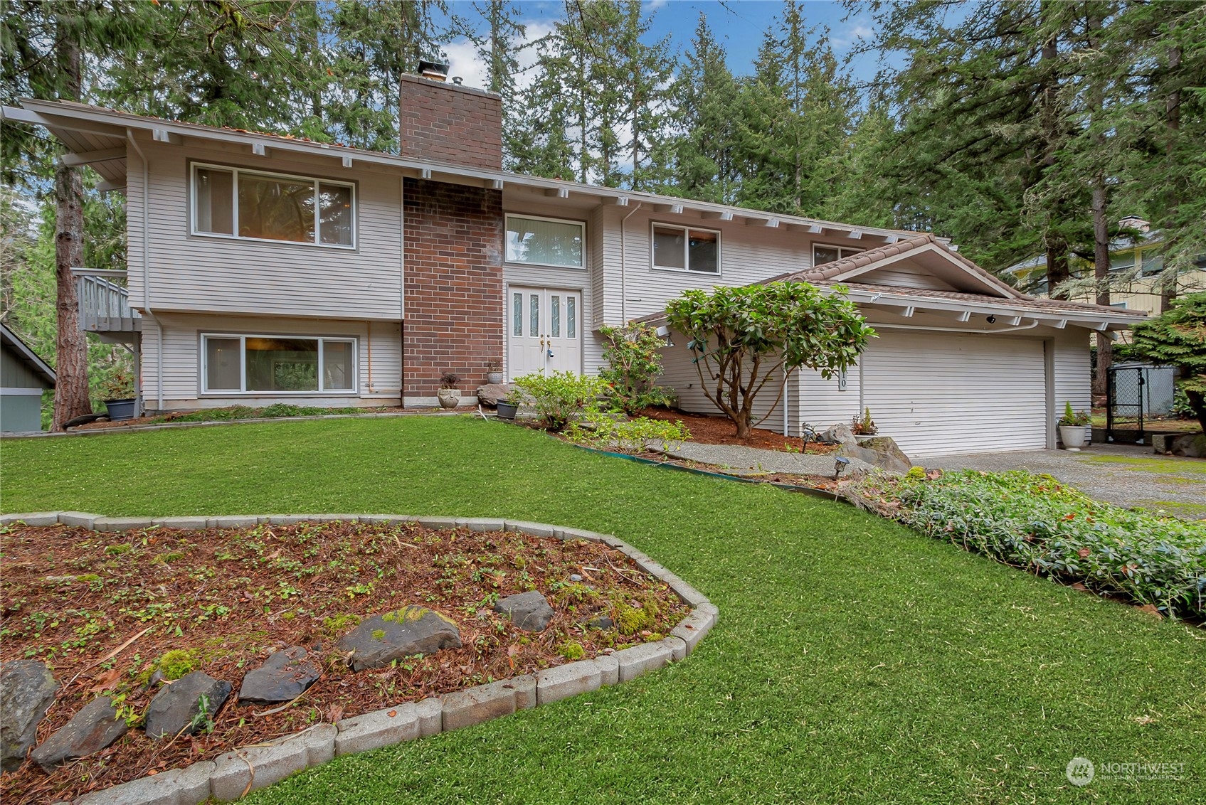 a house view with a garden space