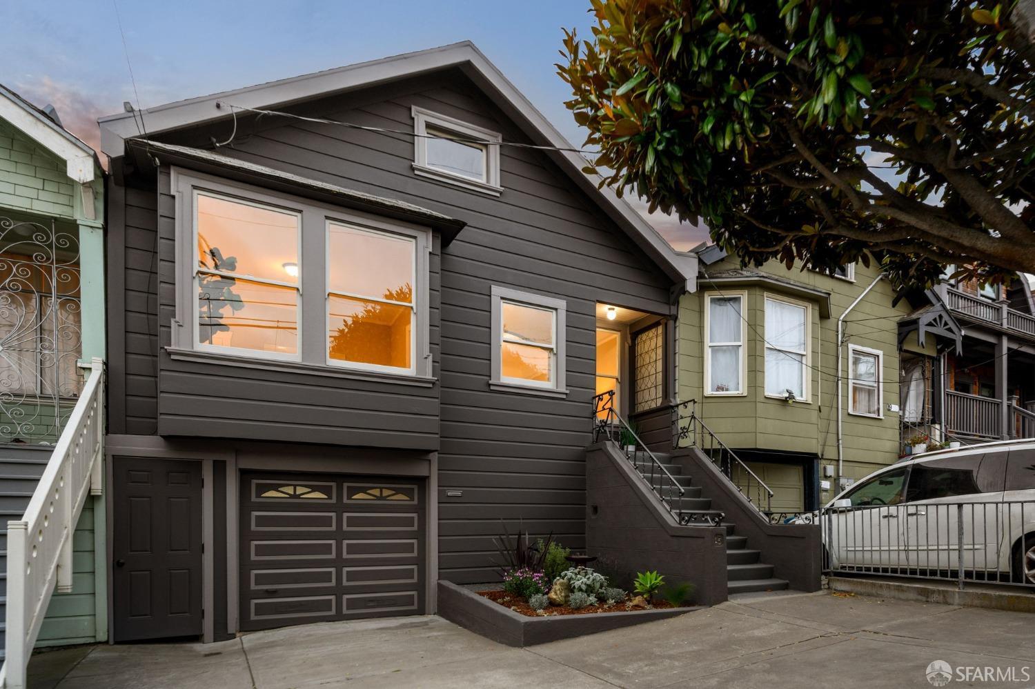 a front view of a house with garage