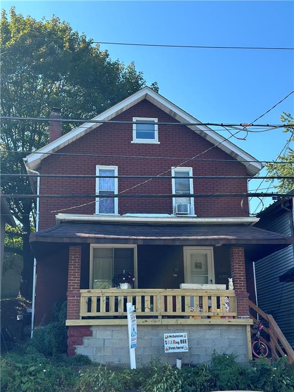 a view of a house with a yard balcony and plants