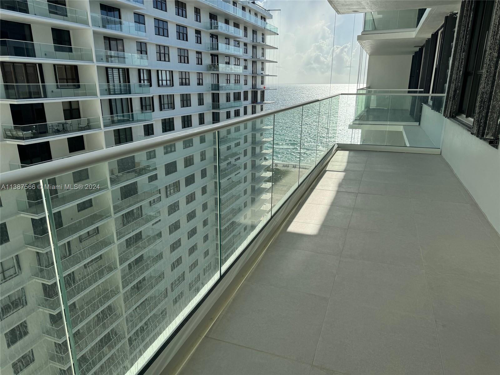 a view of balcony with wooden floor