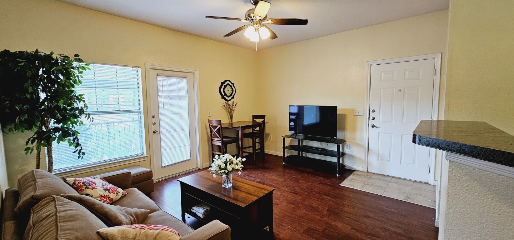 a living room with furniture and a flat screen tv