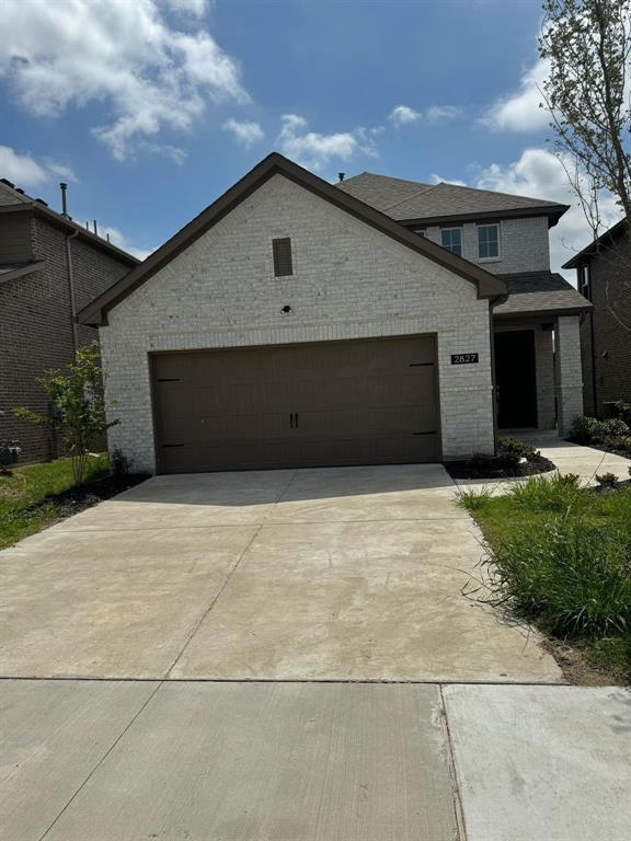 a front view of a house with a garage