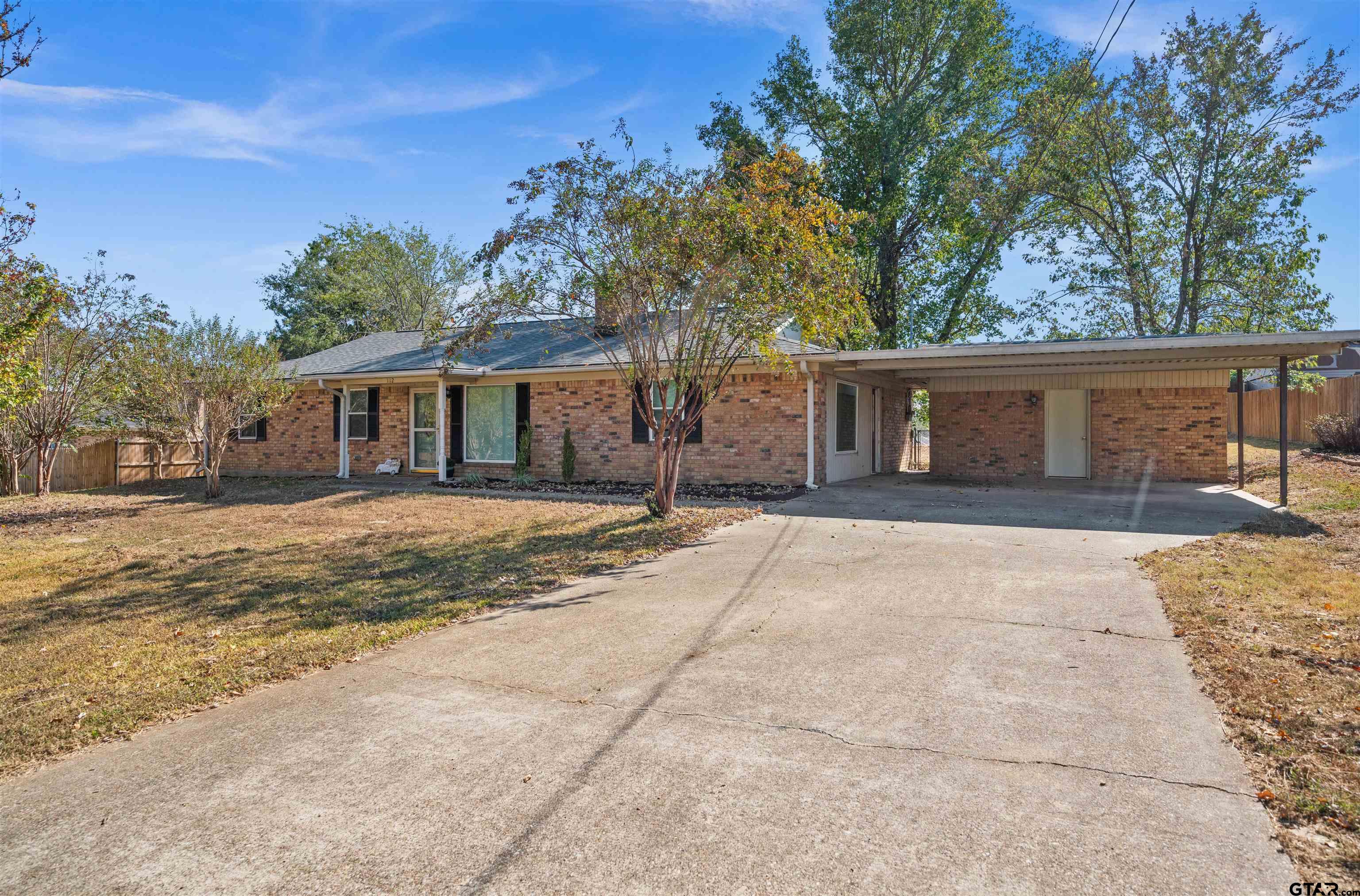 a house with trees in front of it