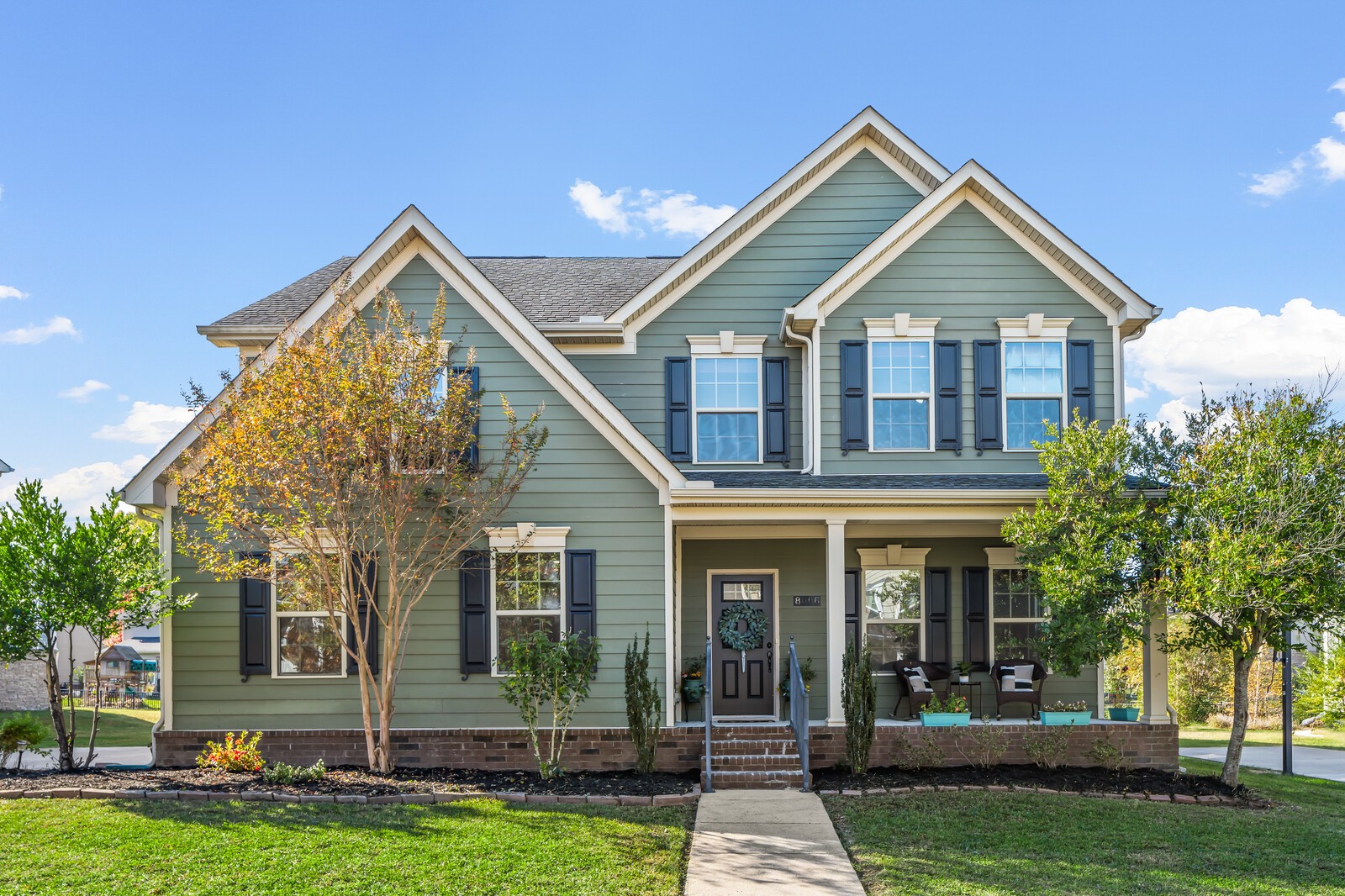 front view of a house with a yard