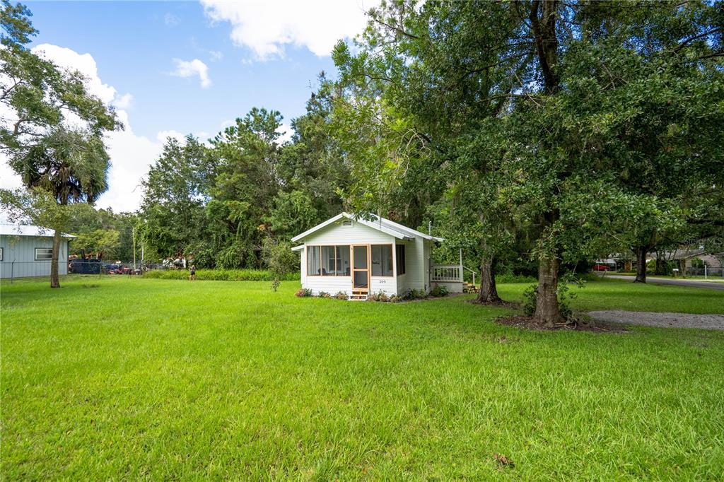 a view of a house with a yard