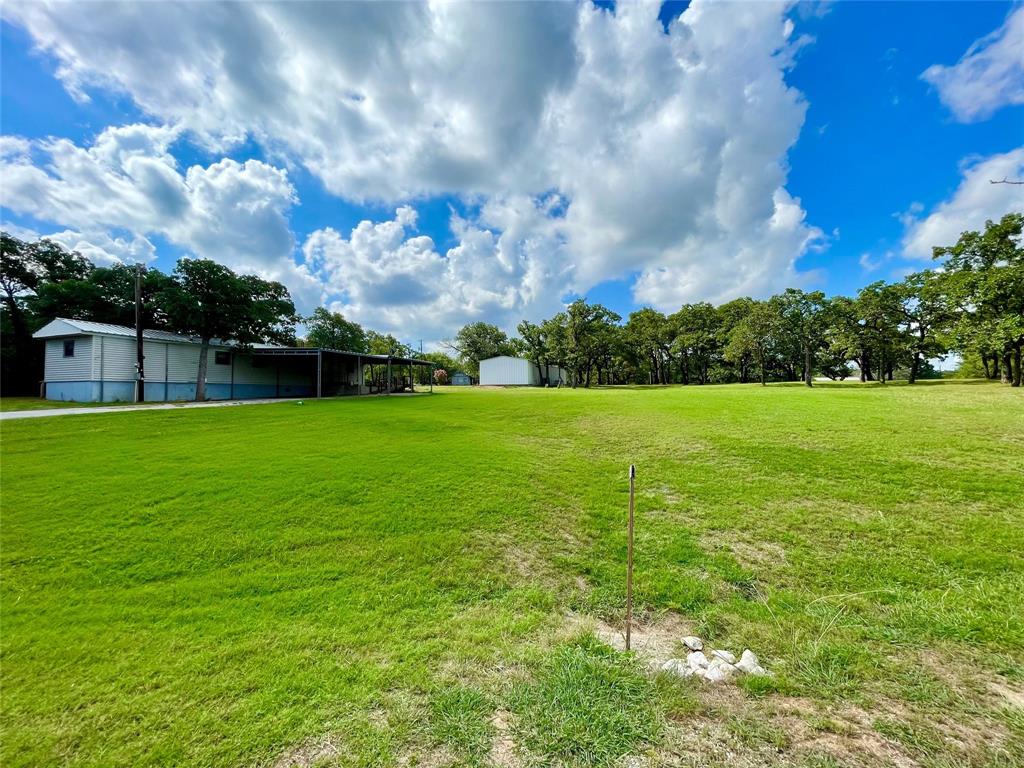 a view of a house with a big yard