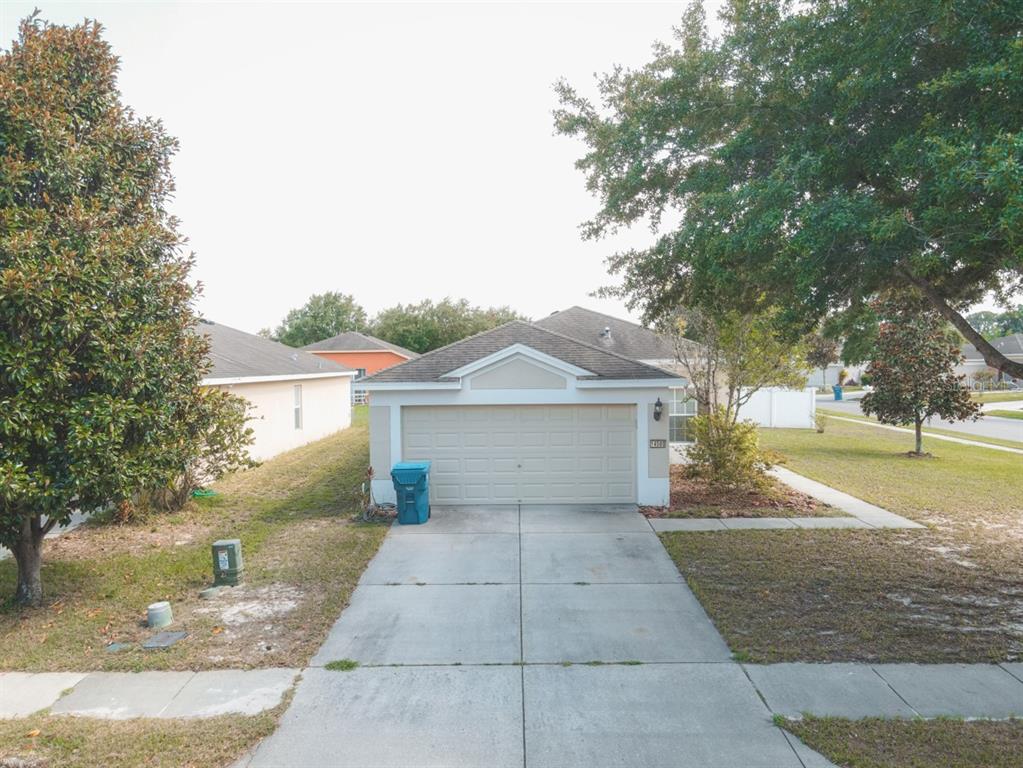 a view of backyard of house with outdoor seating