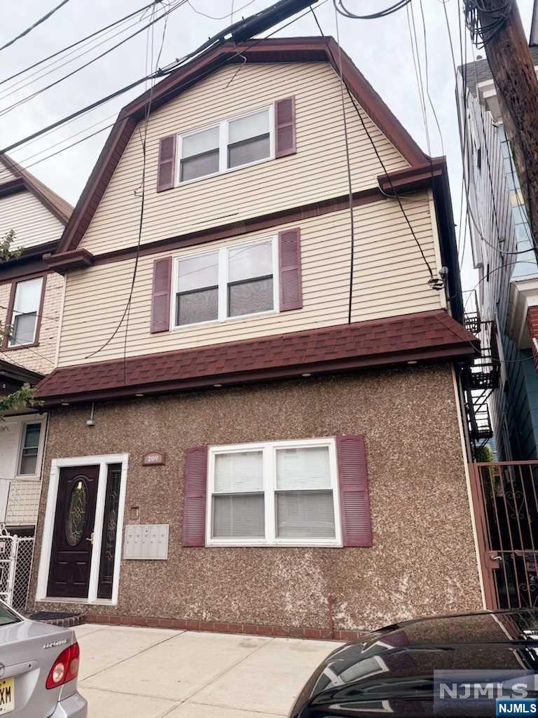 a front view of a house with a garage