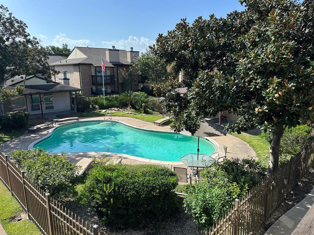 a view of a house with a backyard and a garden