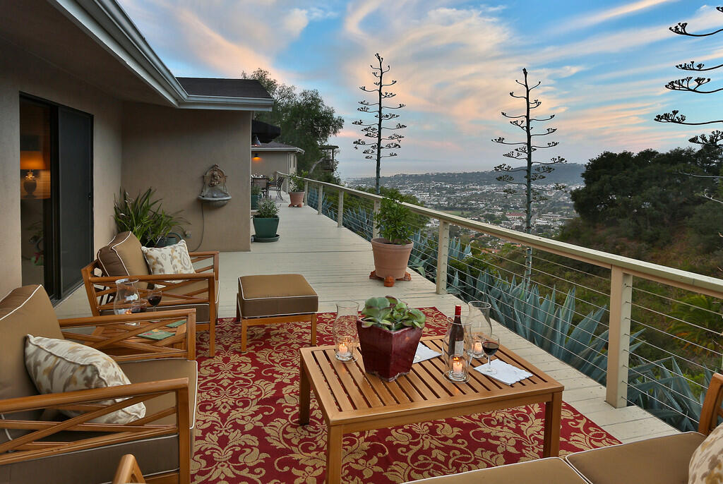 a view of balcony with furniture