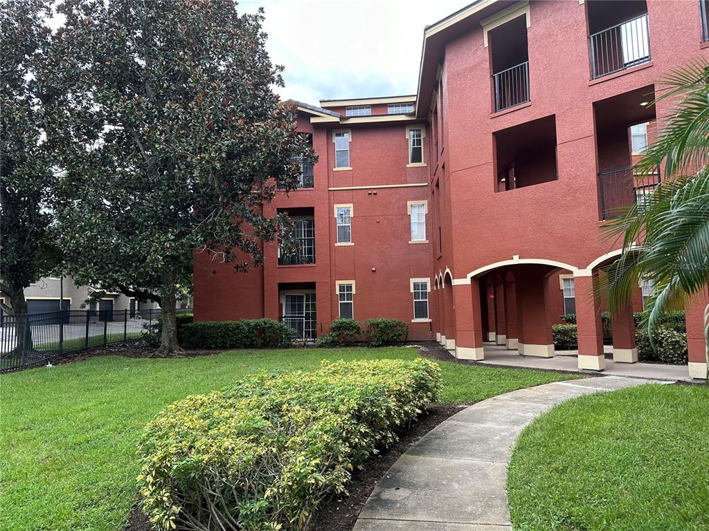 a front view of a building with garden