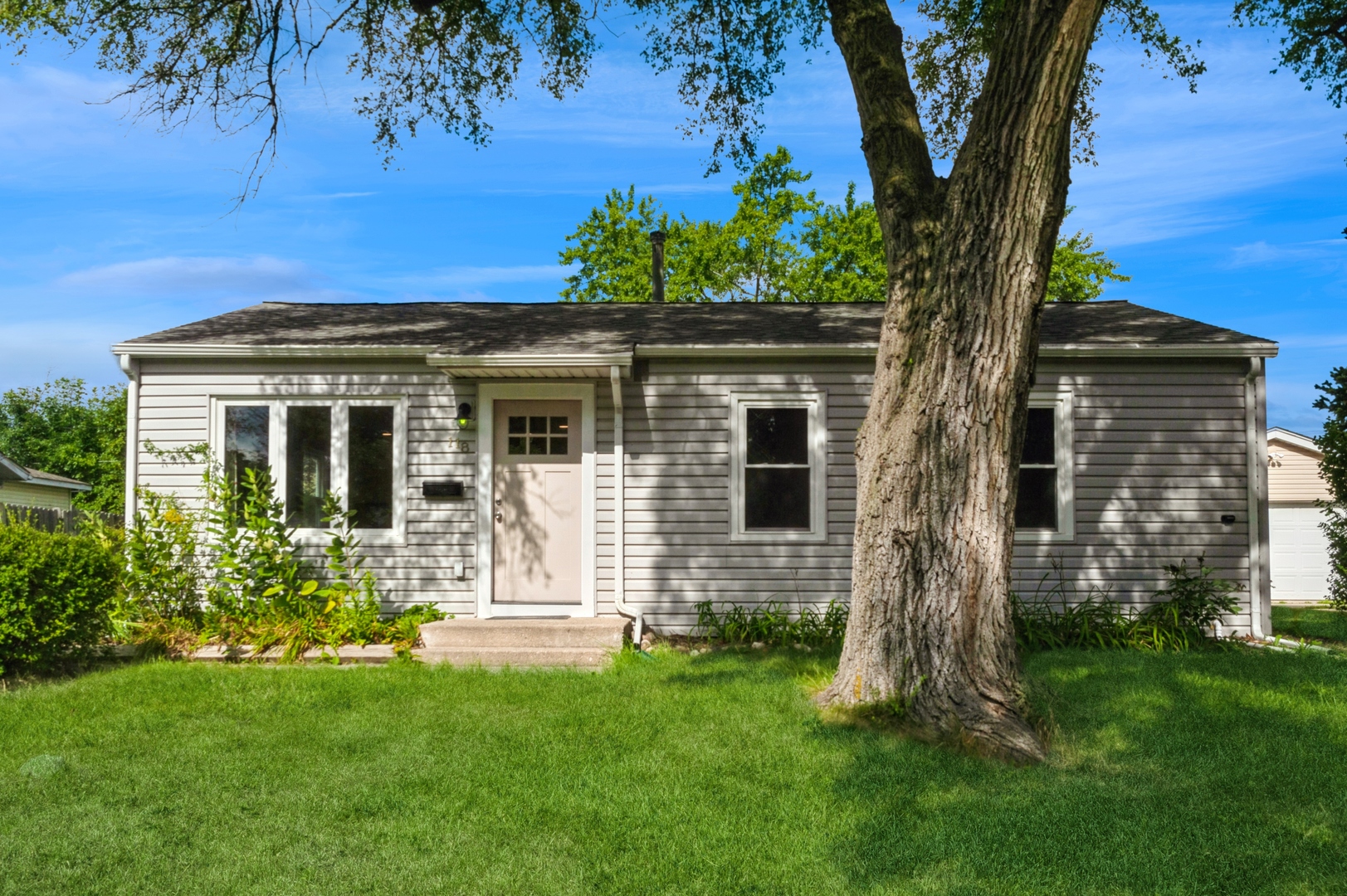 front view of a house with a yard