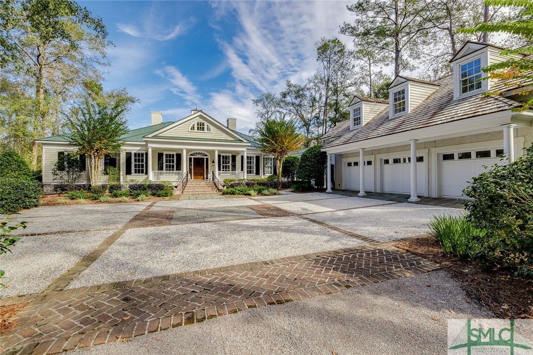 Residence with 3-car garage and apartment above.