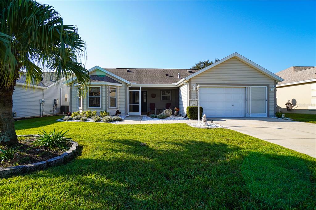 a front view of a house with a yard and porch