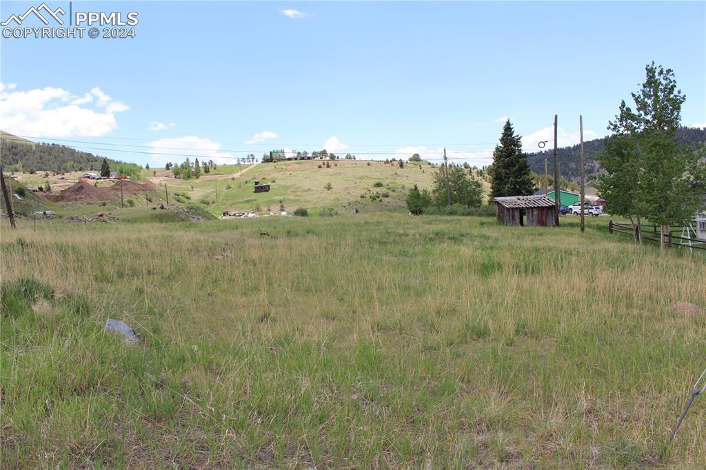 a view of a town with mountains in the background