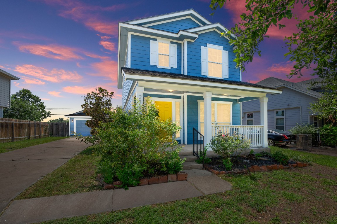 front view of a house with a yard