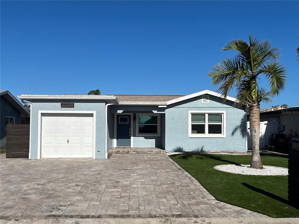 a front view of a house with yard