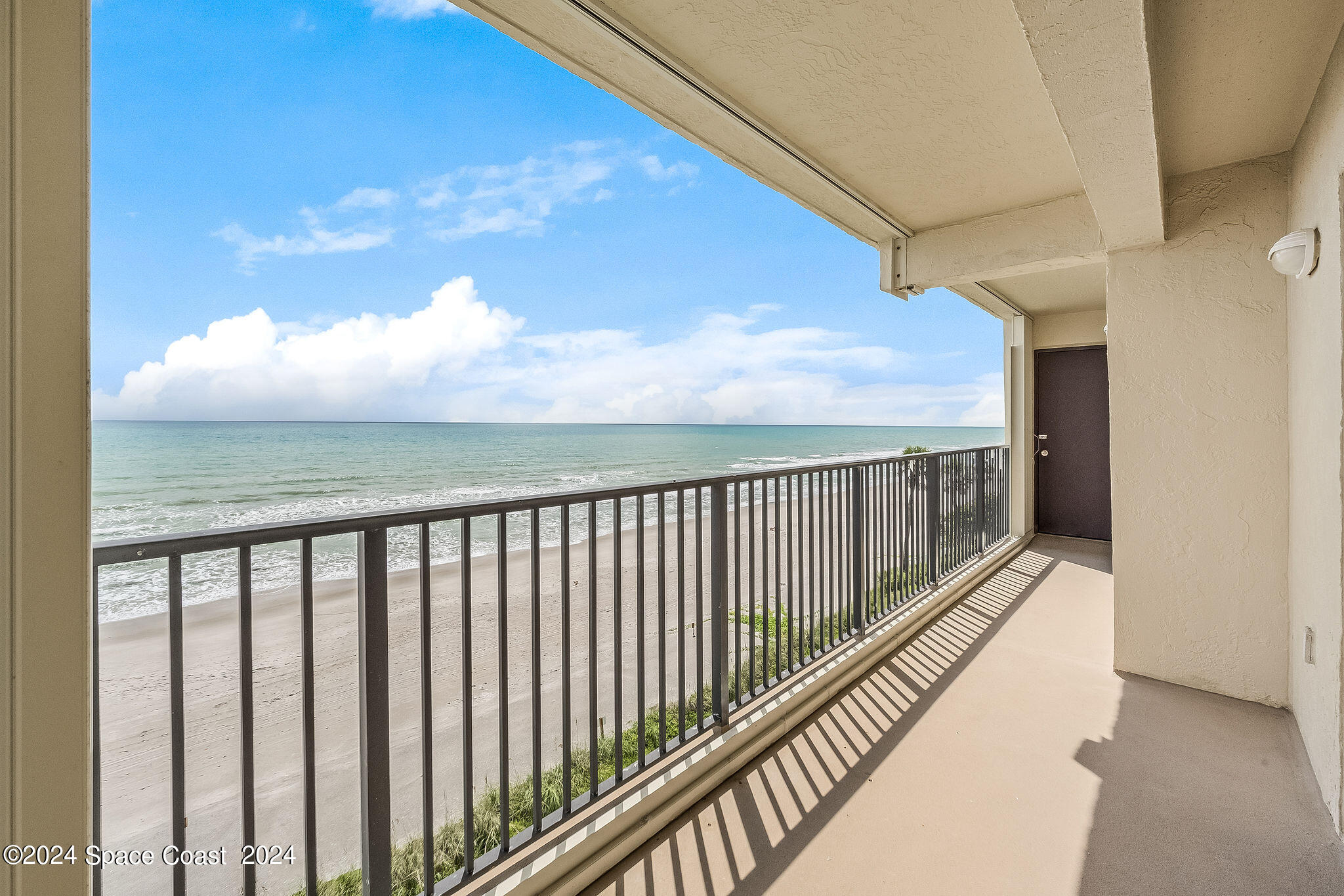 a view of balcony with furniture