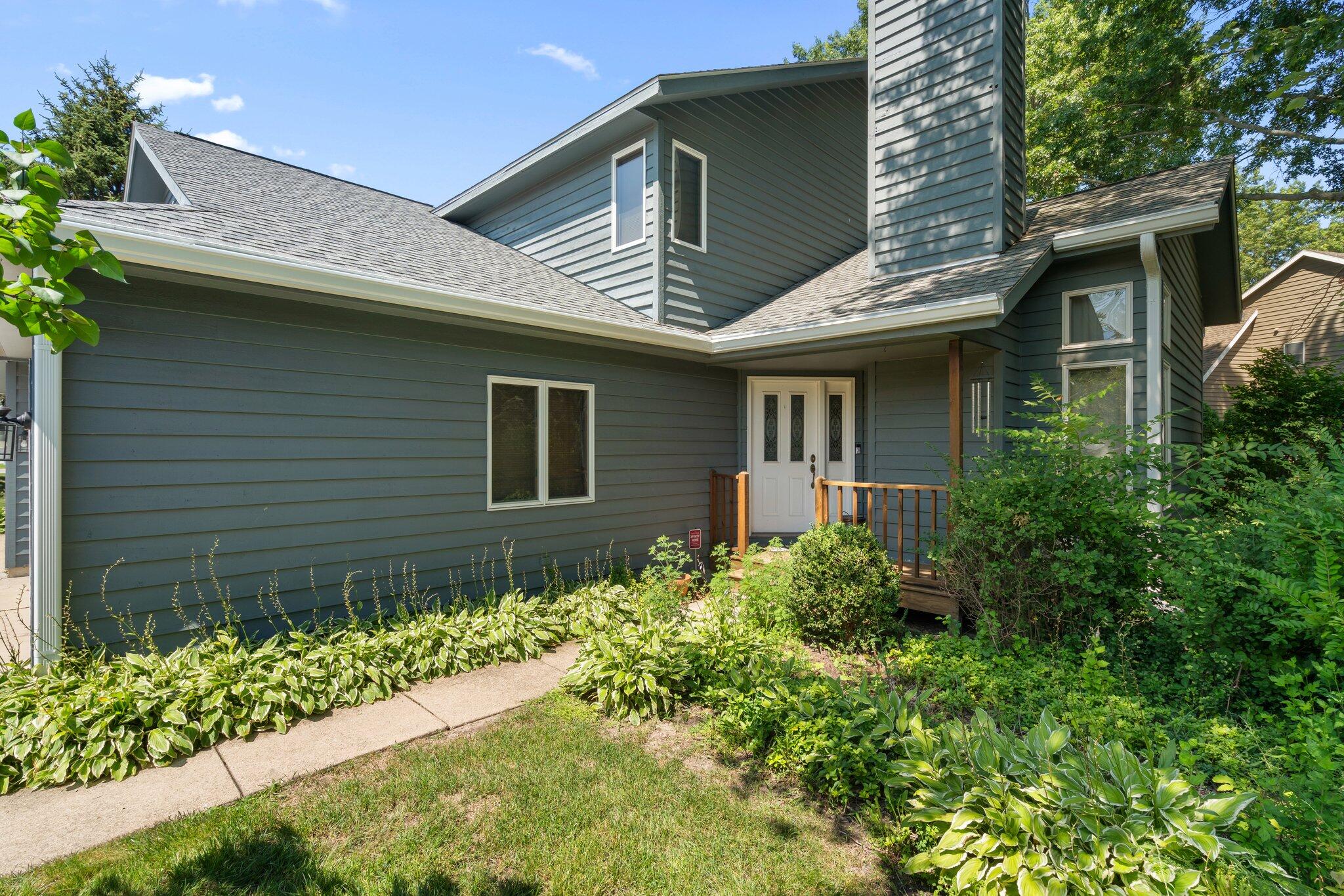 a front view of a house with garden