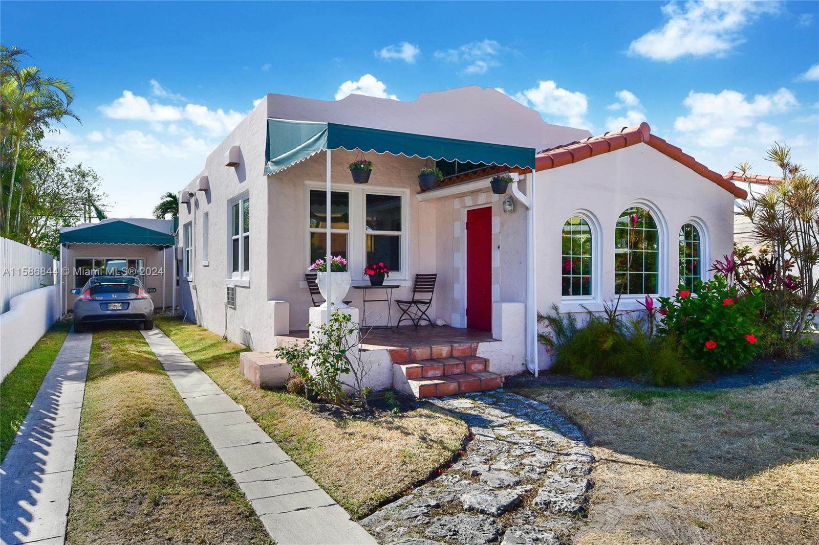 a front view of a house with garden