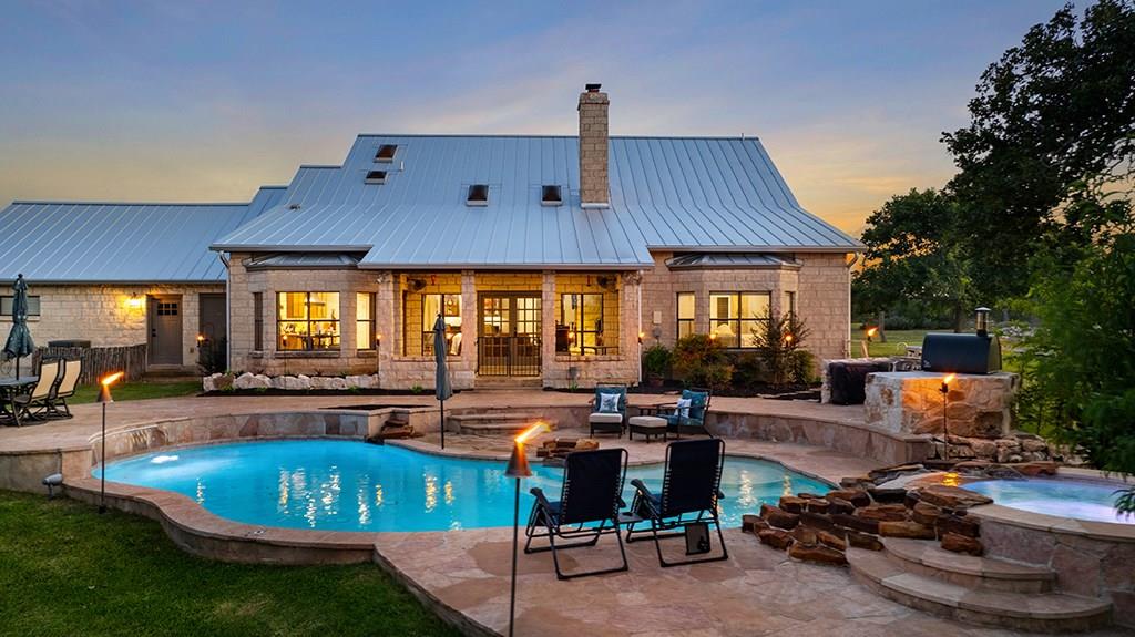 an outdoor space with furniture and umbrella