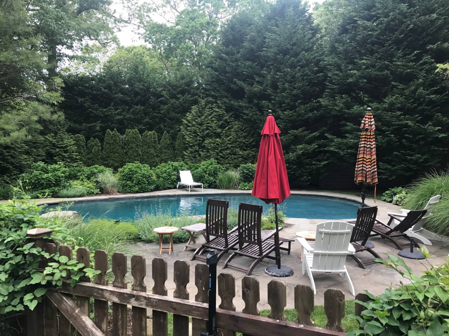 a view of a chairs and table in a lake