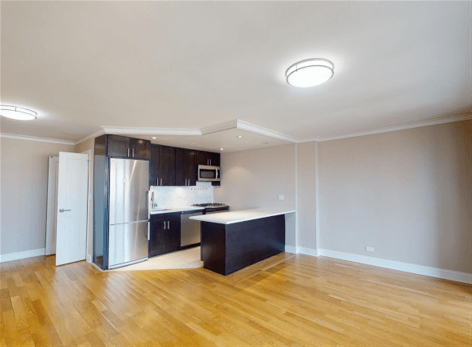 a view of kitchen and refrigerator