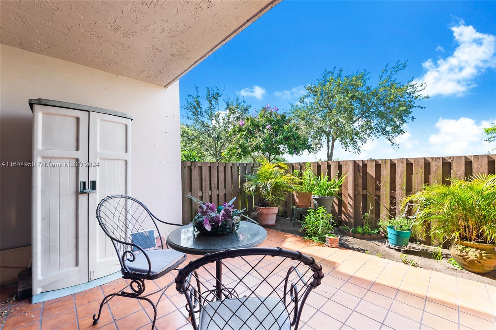 a view of a chairs and tables in the patio